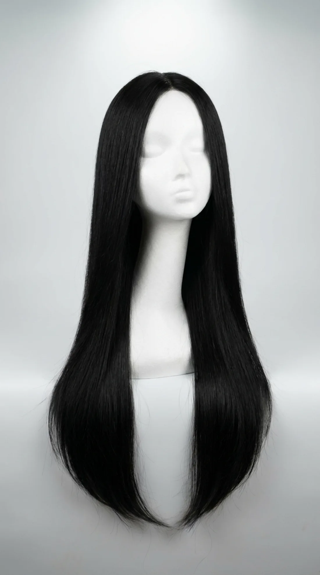 Long black human hair wig on mannequin, three-quarter view