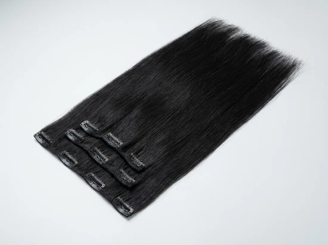 Clip-in human hair extension wefts with seven clips